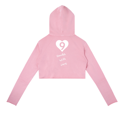 Pink hoodie with a heart and number design on the back against a white background