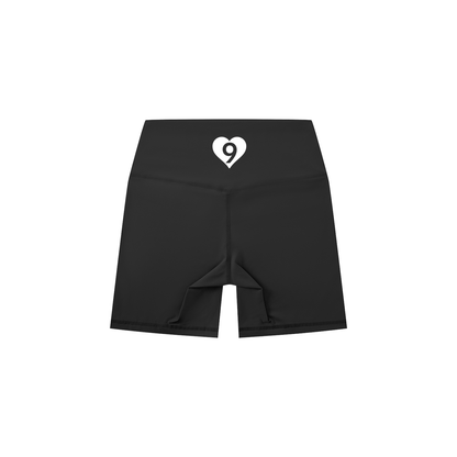 Black athletic shorts with a brand logo on a white background